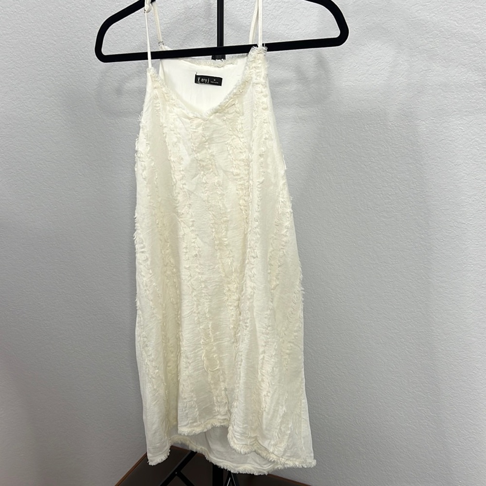 white boutique mini dress with boho lining in size M